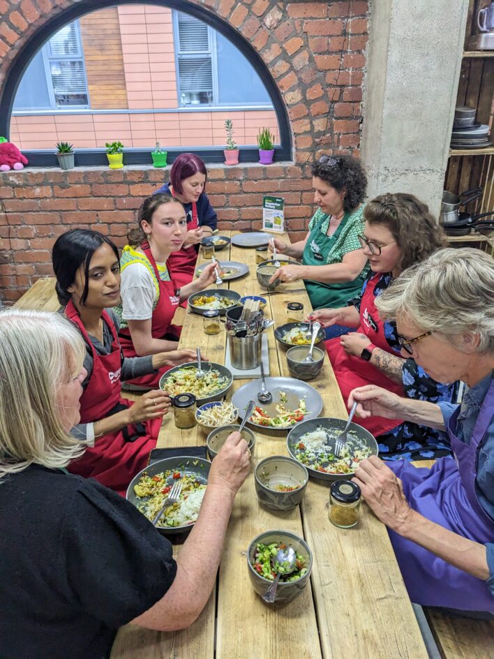 The Fareshare team enjoying their food together. 