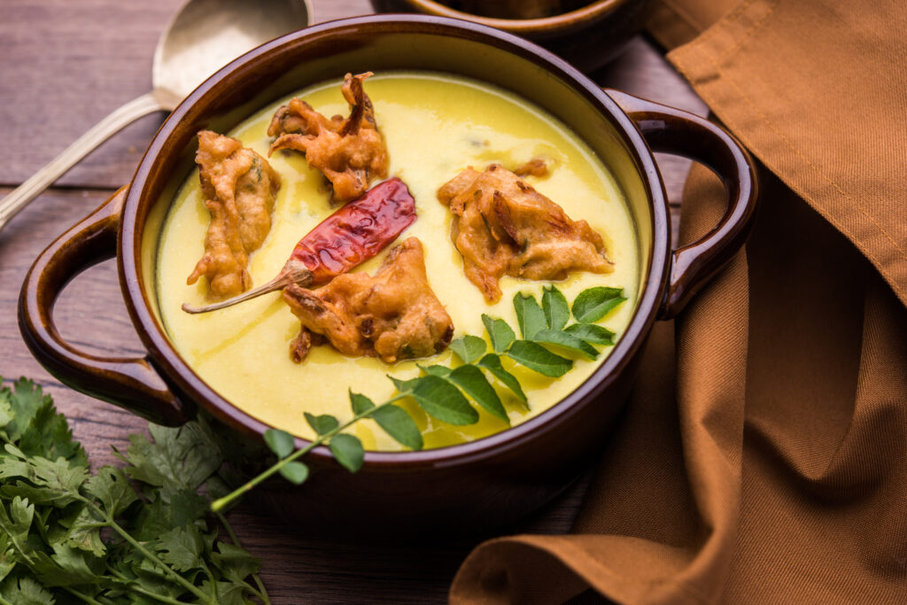 Punjabi Kadhi with vegetable pakora dumplings